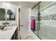 Elegant bathroom showcasing a glass shower, modern tiling, and updated fixtures at 8969 Rivers Edge Dr, Las Vegas, NV 89117