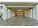 Well-organized garage featuring ample storage cabinets and epoxy flooring at 8969 Rivers Edge Dr, Las Vegas, NV 89117