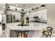 Modern kitchen with white cabinets, stainless steel appliances, and a large center island at 8969 Rivers Edge Dr, Las Vegas, NV 89117