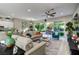 Open living area with views of the outdoor patio and kitchen at 8969 Rivers Edge Dr, Las Vegas, NV 89117
