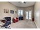 Comfortable home office space with a cozy chair, desk, and ample natural light at 8969 Rivers Edge Dr, Las Vegas, NV 89117