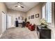 Bright home office featuring neutral walls, plush carpet, and modern decor at 8969 Rivers Edge Dr, Las Vegas, NV 89117