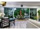 Indoor dining area with an expansive view of the outdoor patio at 8969 Rivers Edge Dr, Las Vegas, NV 89117
