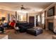 Spacious suite with a bed, seating area, fireplace, and TV, creating a cozy and inviting retreat at 9012 Alpine Peaks Ave, Las Vegas, NV 89147