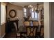 Elegant dining room featuring a chandelier and views into the foyer and kitchen at 9012 Alpine Peaks Ave, Las Vegas, NV 89147