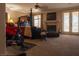 Spacious primary suite with carpet, fireplace, ceiling fan and french doors at 9012 Alpine Peaks Ave, Las Vegas, NV 89147