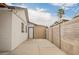 Clean backyard featuring a secure fence, and a convenient access door at 902 Westminster Ave, Las Vegas, NV 89119