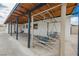 Lovely covered patio area with stylish supports and comfortable seating, perfect for relaxing outdoors at 902 Westminster Ave, Las Vegas, NV 89119