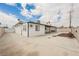 Inviting backyard with a covered patio, concrete flooring, and landscaped area perfect for relaxing and entertaining at 902 Westminster Ave, Las Vegas, NV 89119