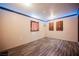 Comfortable bedroom featuring wood floors and a neutral wall paint at 902 Westminster Ave, Las Vegas, NV 89119