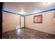 Cozy bedroom featuring wood floors, a window, and neutral wall paint at 902 Westminster Ave, Las Vegas, NV 89119