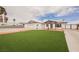 The home has a well-manicured front lawn, brick-paved driveway, and attached garage at 902 Westminster Ave, Las Vegas, NV 89119