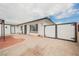 Charming home featuring a brick-paved yard with a covered area and white fence at 902 Westminster Ave, Las Vegas, NV 89119