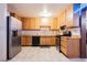Modern eat in kitchen features stainless steel appliances and tile floors at 902 Westminster Ave, Las Vegas, NV 89119