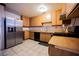 Modern eat in kitchen features stainless steel appliances and tile floors at 902 Westminster Ave, Las Vegas, NV 89119