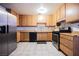 Modern eat in kitchen features stainless steel appliances and tile floors at 902 Westminster Ave, Las Vegas, NV 89119