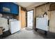 Bright laundry room featuring a washer, dryer, and durable concrete floors at 902 Westminster Ave, Las Vegas, NV 89119