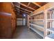 Spacious storage room with shelving, wood beam ceiling and door for easy organization at 902 Westminster Ave, Las Vegas, NV 89119