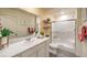Bright bathroom featuring modern vanity, a glass-enclosed shower, and neutral decor at 9338 Soothing Sea St # Lot 90, Las Vegas, NV 89178