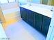 Bathroom featuring double sinks and a tub for comfort and convenience at 95 Palm Park Ct, Las Vegas, NV 89183