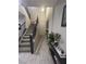 Bright entryway featuring stairway, coat closet and tile flooring at 95 Palm Park Ct, Las Vegas, NV 89183