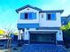 Charming two-story home featuring a two-car garage, covered porch, and stone accents at 95 Palm Park Ct, Las Vegas, NV 89183