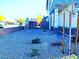 Low maintenance front yard featuring gravel landscaping and covered porch at 95 Palm Park Ct, Las Vegas, NV 89183