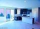 Modern kitchen with stainless steel appliances, granite countertops, and island with breakfast bar at 95 Palm Park Ct, Las Vegas, NV 89183