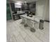 Spacious kitchen with granite countertops and stainless steel appliances at 95 Palm Park Ct, Las Vegas, NV 89183
