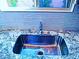 Close up of kitchen sink with tiled backsplash and granite counter tops at 95 Palm Park Ct, Las Vegas, NV 89183