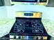 Stainless steel stove with granite countertops and a white backsplash at 95 Palm Park Ct, Las Vegas, NV 89183