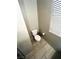 Neat toilet room with a modern toilet, a window for natural light, and stylish tile flooring at 95 Palm Park Ct, Las Vegas, NV 89183