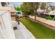 Manicured backyard with verdant lawn and mature trees at 9604 Windom Point Ave, Las Vegas, NV 89129