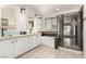Bright bathroom features a double vanity, soaking tub, and glass-enclosed shower at 9604 Windom Point Ave, Las Vegas, NV 89129