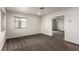Well-lit carpeted bedroom with a window and a doorway to another room at 9604 Windom Point Ave, Las Vegas, NV 89129