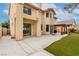 Two-story home featuring a balcony, covered patio, stucco siding, and a well-maintained backyard at 9604 Windom Point Ave, Las Vegas, NV 89129