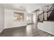 Spacious foyer with wood-look floors, plenty of natural light and a staircase with decorative wrought iron at 9604 Windom Point Ave, Las Vegas, NV 89129
