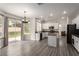 Eat-in kitchen features white cabinets, modern appliances, a kitchen island and access to the backyard at 9604 Windom Point Ave, Las Vegas, NV 89129