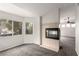 This living room features neutral walls and a modern fireplace at 9604 Windom Point Ave, Las Vegas, NV 89129
