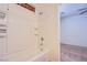 Bathroom showcasing a shower-over-tub and access to an adjacent bedroom at 961 Wembly Hills Pl, Henderson, NV 89011