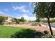 Serene community park featuring picnic tables, benches, lush green grass, and a tranquil atmosphere at 961 Wembly Hills Pl, Henderson, NV 89011