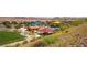 Picturesque community park with playgrounds, picnic areas, green lawns, and scenic hillside views at 961 Wembly Hills Pl, Henderson, NV 89011
