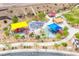 Aerial shot of a community park with multiple playgrounds and picnic areas, perfect for Gathering outings at 961 Wembly Hills Pl, Henderson, NV 89011