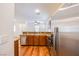 Kitchen with stainless steel appliances, wood floors, and granite counters at 961 Wembly Hills Pl, Henderson, NV 89011