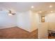 Open loft area features a ceiling fan, carpet, and easy access to bedrooms and bathrooms at 961 Wembly Hills Pl, Henderson, NV 89011