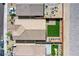 Aerial view of a landscaped backyard with artificial turf, patio and outdoor seating area at 10281 Sequoia Falls Pl, Las Vegas, NV 89149