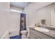Clean bathroom featuring a shower-tub combo, granite countertop, and vanity at 10281 Sequoia Falls Pl, Las Vegas, NV 89149