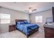 Spacious bedroom with a ceiling fan, window blinds, and matching nightstands at 10281 Sequoia Falls Pl, Las Vegas, NV 89149