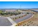 View of landscaped community entrance, gate, and nearby homes in a planned community at 10281 Sequoia Falls Pl, Las Vegas, NV 89149