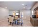 Open-concept dining area leads to the living room for easy entertaining and relaxed Gathering time at 10281 Sequoia Falls Pl, Las Vegas, NV 89149